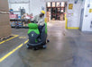 Rider Floor Scrubber Cleaning a Warehouse Floor Thumbnail