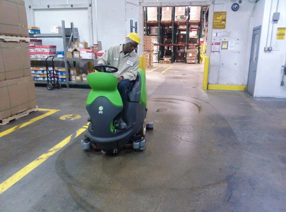 Rider Floor Scrubber Cleaning a Warehouse Floor Thumbnail